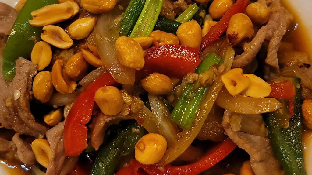 Spicy Peanut - New · Whole peanut, Jalapeños, bell peppers and onions stir-fried in brown garlic sauce.