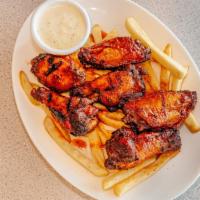 Ranchero Wings · Traditional chicken wings, tossed with your choice of buffalo sauce or barbecue sauce. Serve...