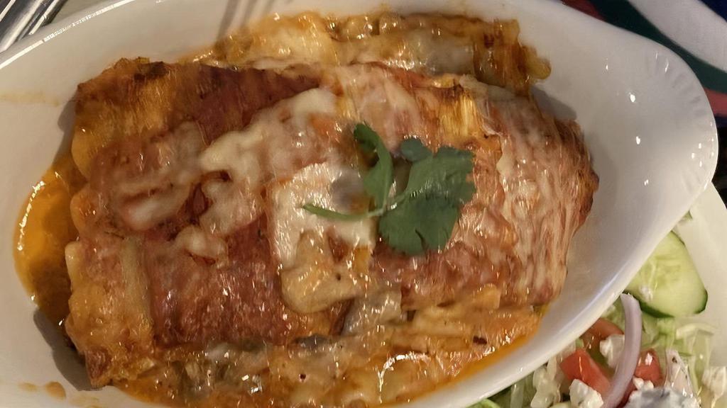 Lasagna · Traditional homemade lasagna, served with a small side salad.