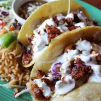 French Tacos · Tortilla covered with melted cheese, caramelized onions, chorizo sausage, skirt steak, chipo...