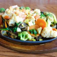Vegetable Fajitas · Sautéed spinach, fresh diced tomato with portobello mushrooms, corn, carrots, broccoli, and ...