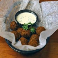 Falafel Appetizer · Finely ground chickpeas seasoned with onions, garlic, parsley, and spices, lightly fried and...