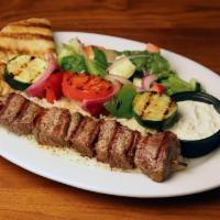 Steak Kabob · Served with rice, grilled vegetables, salad, pita bread and tzatziki sauce. Choice of regula...