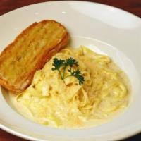 Fettuccini Alfredo · A special Fettuccini tossed with our homemade Alfredo sauce. Served with grilled ciabatta an...