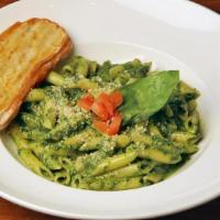 Penne With Basil Pesto · Penne pasta tossed with our homemade basil pesto and topped with freshly shaved Parmesan. Se...