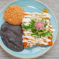 Classic Enchiladas · choice of protein, entomatada, lettuce,.  pickled onion, sour cream, with rice & black beans