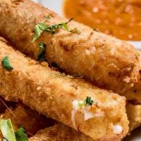 Fried Mozzarella Sticks · Fresh, hand-rolled mozzarella battered and fried to a golden brown, served with spicy marina...