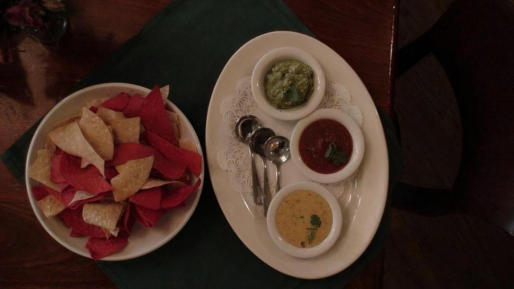 Chips & Three Dips (Gf, V) · Fresh tortilla chips with house-made queso, guacamole and salsa.