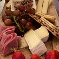 Charcuterie Board · Assorted cheeses with genoa salami & olive tapenade.