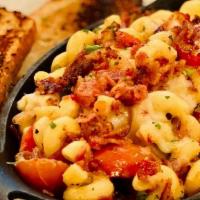 Deluxe Macaroni & Cheese · Cavatappi noodles tossed in a cheddar and parmesan sauce with cherry tomatoes, scallions and...