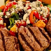 Bistro Filet Steak Salad · Sliced, tender bistro filet over mixed greens with grilled onions, cherry peppers, fresh tom...