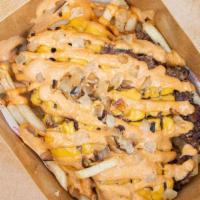 Slutty  Fries · Seasoned fries, chopped pattie with cheese, slut sauce, grilled onions.
