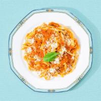 Fettuccine Bolognese · Fettuccine in a traditional Bolognese sauce topped with fresh Parmesan cheese.