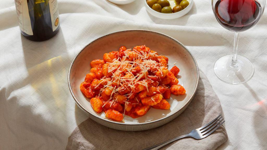 Gnocchi Alla Vodka · Fluffy gnocchi coated in a delicious, creamy vodka sauce, and topped with fresh Parmesan cheese.