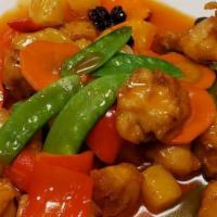 Kung Pao Chicken · Spicy. soy & wheat gluten, yellow, red, green bell peppers, peanuts and hot peppers in brown...