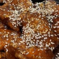 Sesame Chicken · Chunks of boneless chicken deep-fried to golden brown then sauteed in sweet and sour sesame ...