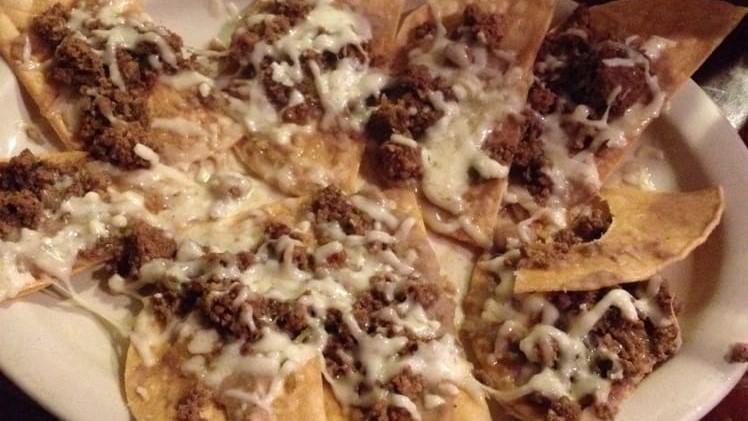 Nachos Plate · Fresh tortilla chips smothered in cheese