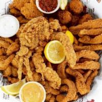 Big Eazy · Have it all! Catfish, shrimp, calamari and soft shelled crab, all golden fried with hush pup...