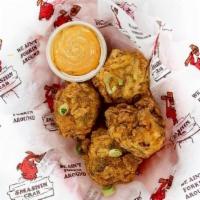 Boudin Balls · Ground pork, rice and spices rolled into 4 large balls crispy fried served with remoulade