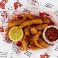 Calamari Strips · Tender calamari strips dusted with Cajun spice and served with potent cocktail sauce