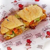 Catfish Po'Boy · Dressed with lettuce, tomato, pickle and mayo on a French roll