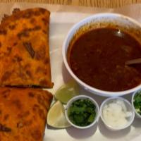 Birria Quesadilla · Large flour tortilla filled with beef birria & cheese with onion, cilantro a side of consomm...