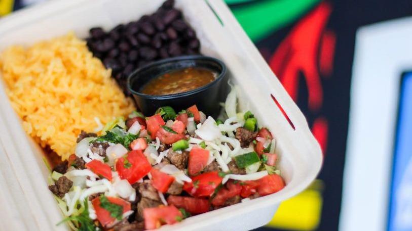 Frida Bowl With Carne Asada · A bowl with carne asada, rice, beans, cheese, lettuce, tomato, onion, and cilantro. Served with a side of homemade salsa. Add guacamole for an additional charge.