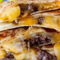 Quesadilla With Carne Asada · Cheesy heaven. Flour tortilla, carne asada, and mixed cheese. Served with a side of homemade...