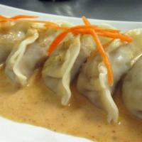 Thai Pot Stickers (6 Pcs.) · Vegetable pot stickers with red curry sauce.