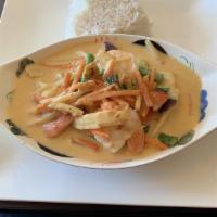 Green Curry · Spicy. Green curry paste in coconut milk with string beans, bamboo shoot, baby corns, basil,...