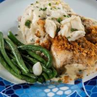 New England Cod · Cracker-crusted cod, jumbo lump crab meat, mashed potatoes, and tarragon butter sauce.