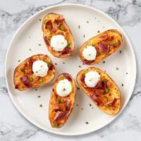 Baked Potato Skins · (6 pieces) Baked potato skins filled with cheddar cheese, bacon, and chives. Served with sou...