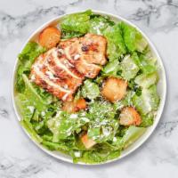 Classic Chicken Caesar Salad · Romaine lettuce, grilled chicken, house croutons, and parmesan cheese tossed with caesar dre...