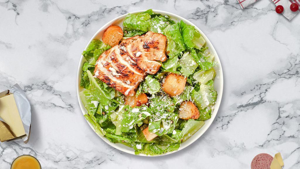 Classic Chicken Caesar Salad · Romaine lettuce, grilled chicken, house croutons, and parmesan cheese tossed with caesar dressing.