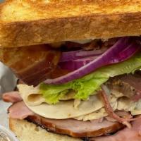 Man Cave Sandwich · House made corned beef brisket, turkey, ham, bacon, Colby jack provolone, red onion, lettuce...