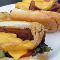 Fish Hoagie · Whiting Filets seasoned, marinated, & fried to a golden crisp and served on a hoagie roll wi...