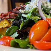 Garden Salad · Mixed baby greens, carrots, cucumber, red onion, tomatoes, & croutons served with the dressi...