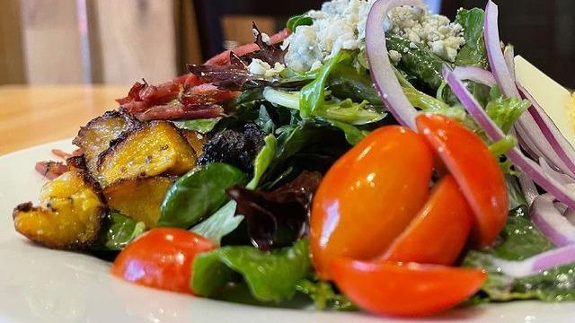 Garden Salad · Mixed baby greens, carrots, cucumber, red onion, tomatoes, & croutons served with the dressing your choice.