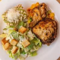 Baked Chicken Dinner · Quarter leg of chicken served over yellow rice with the choice of 2 sides