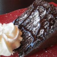 Chocolate Cake · 3 layered chocolate cake topped with sugar powder & chocolate syrup