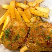 Fish & Chips · Two pieces of cod, fries, and parsley sprinkled.