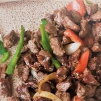 Lega Tibs Beef Or Lamb · Sautéed with onion, garlic, jalapeño pepper, purified Ethiopian butter with Injera served wi...