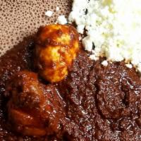Doro Wot (Chicken)  · Onion, garlic, red chili pepper, Ethiopian purified butter comes with  cottage cheese served...