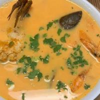 Sopa De Mariscos · Soup made with crab, mackerel fish, shrimp, seafood mix and heavy cream. Served with 2 torti...