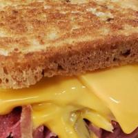 New Yorker · Hot  pastrami, corned beef, melted swiss, sweet and spicy mustard on grilled rye.