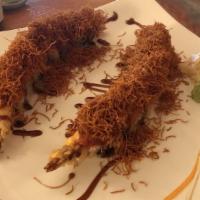 Tsunami Roll · shrimp tempura outside spicy tuna, sweet potato crunch