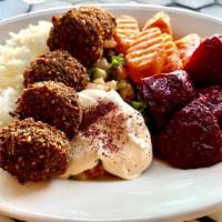 Middle Eastern Plate · falafel, marinated beets, spicy moroccan carrots, & arabic salad, served w/ jasmine rice & t...