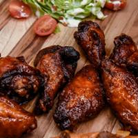 Banshee Wings · Jumbo seasoned wings tossed in our secret sweet and spicy banshee sauce.