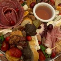 Charcuterie Board · Artisan cured meats, Gorgonzola and herb goat cheese, local Texas honey, roasted garlic clov...