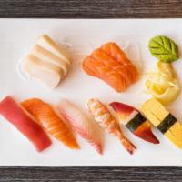 Sushi Sashimi Combo · 6 pcs sashimi and 6 pcs sushi: tuna, salmon, red snapper, shrimp, red clam, egg.